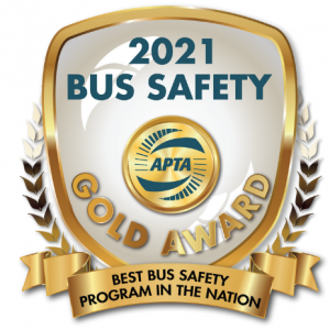 Emblem that is inscribed with 2021 Bus Safety Gold Award from APTA - Best Bus Safety Program in the Nation.